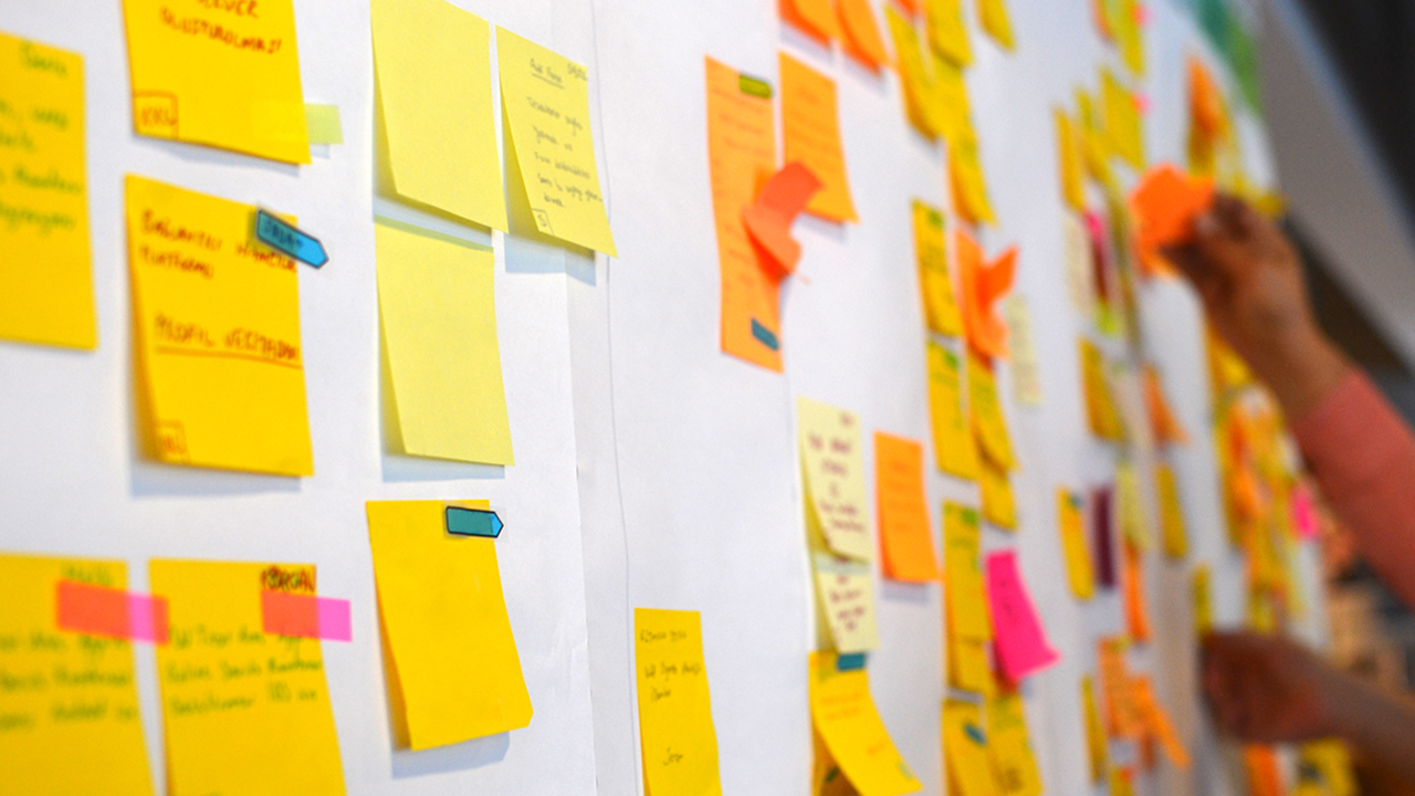 yellow post-it notes on a white wall